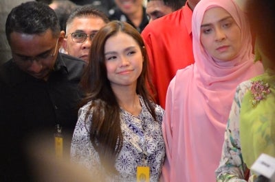 Bella (left) with Syed Saddiq's sister, Sharifah Amani. (PHOTO BY ASRIL ASWANDI SHUKOR)
