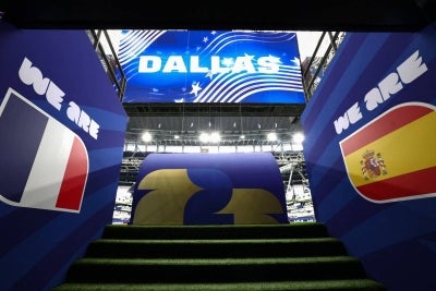 A view of the tunnel entrance featuring the flags of France and Spain at the Dallas Stadium in Arlington (Photo by FRANCK FIFE / AFP)