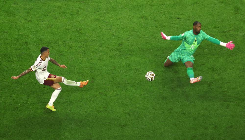 Pedro Porro #12 of Spain scores his team's second goal past Mike Maignan #16 of France during the FIFA World Cup 2026 Semi Final match between France and Spain at Dallas Stadium. Photo by Stacy Revere/Getty Images via AFP