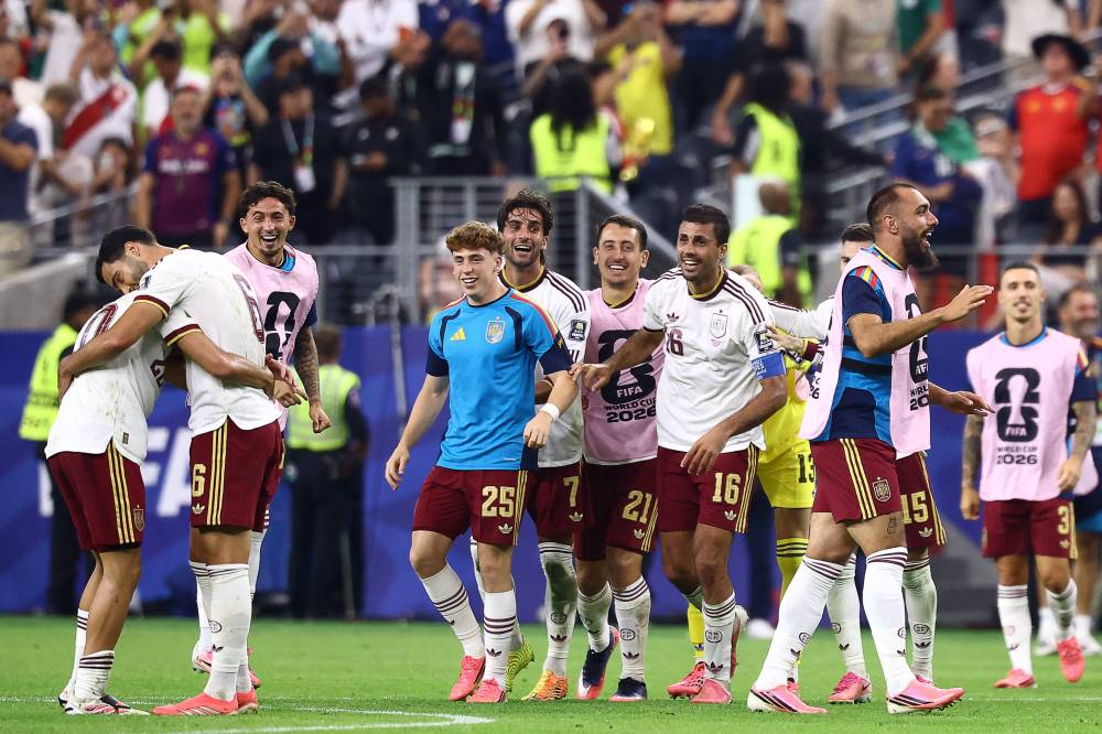 Spain's midfielder #06 Mikel Merino, forward #25 Victor Munoz, forward #07 Ferran Torres, forward #21 Mikel Oyarzabal and midfielder #16 Rodri celebrate after winning the 2026 World Cup football tournament semi-final match between France and Spain at the Dallas Stadium in Arlington. Photo by Charly Triballeau/AFP