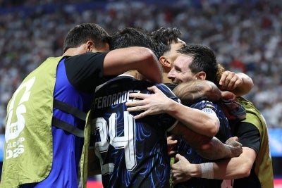 Argentina celebrates during the 2026 World Cup football tournament semi-final match between England and Argentina. (Photo by Thomas COEX / AFP)