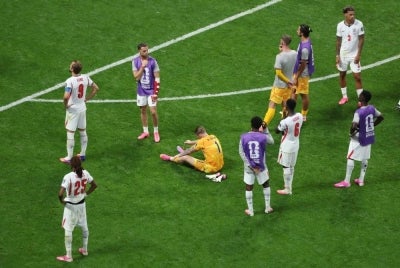 England players in distraught after their defeat against Argentina in the semis (Photo by PATRICIA DE MELO MOREIRA / AFP)