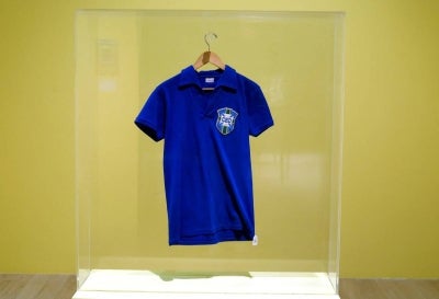The jersey worn by Brazilian football legend Pele during the 1958 FIFA World Cup final (Photo by TIMOTHY A. CLARY / AFP)