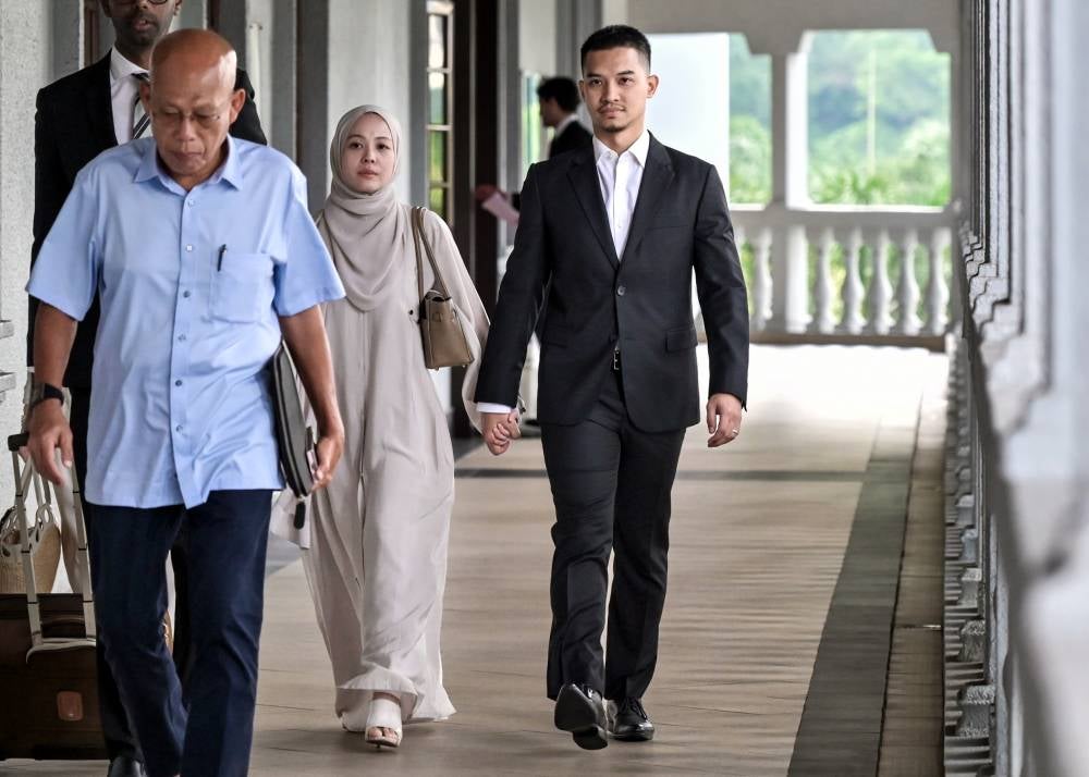 FashionValet Sdn Bhd founders Datin Vivy Yusof and her husband Datuk Fadzarudin Shah Anuar at the Kuala Lumpur Sessions Court today for their criminal breach of trust trial involving RM8 million in investment funds. - Photo by Bernama