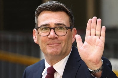 Andy Burnham waves as he leaves Labour’s 'Special Conference' where he was confirmed as the Labour Party's new leader and the country's next Prime Minister, in central London on July 17, 2026. - (Photo by Toby Shepheard / AFP)
