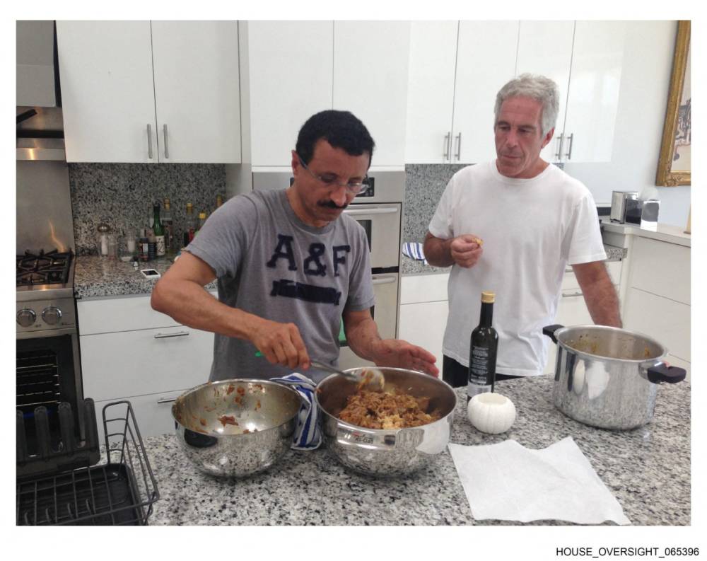 This undated and unlocated handout image released by Democrats on the House Oversight Committee on December 18, 2025 shows late convicted sex offender Jeffrey Epstein (R) cooking with CEO of DP World Sultan Ahmed bin Sulayem. Democratic lawmakers released a new cache of photos and documents on December 18 from the estate of convicted sex offender Jeffrey Epstein. (Photo by House Oversight Democrats / AFP) 