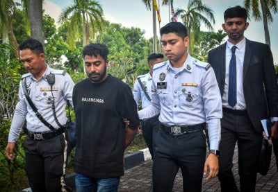 Bangladeshi plantation worker Md Habibullah, 28, was charged at the Shah Alam magistrate's court, today with reckless driving that resulted in the death of a food delivery rider in Puncak Alam on July 21, 2026. - Photo by Bernama