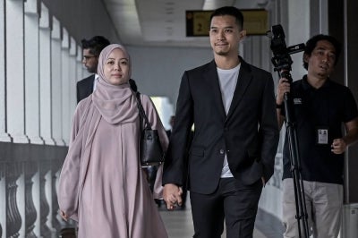 FashionValet founders Datin Vivy Yusof and her husband Datuk Fadzarudin Shah Anuar at the Kuala Lumpur Sessions Court, today for their CBT trial involving RM8 million investment funds from Khazanah and PNB. - Photo by Bernama