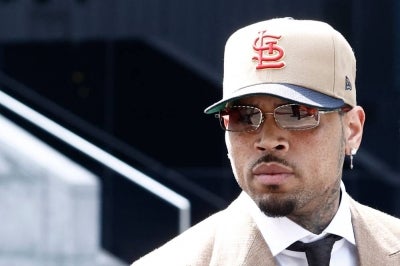US singer Chris Brown arrives at Southwark Crown Court in London on July 24, 2026. - (Photo by Brook Mitchell / AFP)