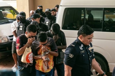 Car wash owner A. Ravichandran, 45; R. Elanggovan, 43; M. Jeyaraj, 43; used oil trader Moses De Bretto John Patrick, 40; Ziyauddin, 33; and e-hailing driver Muhammad Afiq Safine, 36, pleaded not guilty in the Petaling Jaya Sessions Court today to charges of kidnapping a businessman and demanding RM8 million in ransom two weeks ago. - Photo by Bernama