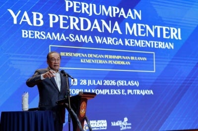 Prime Minister Datuk Seri Anwar Ibrahim giving his speech during a meeting with Education Ministry staff today. Photo by Bernama