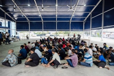 Rohingya refugees are at the Kuala Lumpur Police Contingent Headquarters (IPK) today after being relocated from outside the office of the United Nations High Commissioner for Refugees (UNHCR) at Jalan Bukit Petaling. - Photo by Bernama