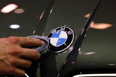 BMW employs about 154,000 people worldwide and the offer would be open to German employees in desk-based roles, the source said. (Photo by Alexandra BEIER / AFP)