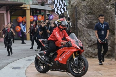 National Moto3 sensation Muhammad Hakim Danish Ramli at the MoU signing ceremony between Genting Sky Worlds and ZK Racing, today. - Photo by Bernama