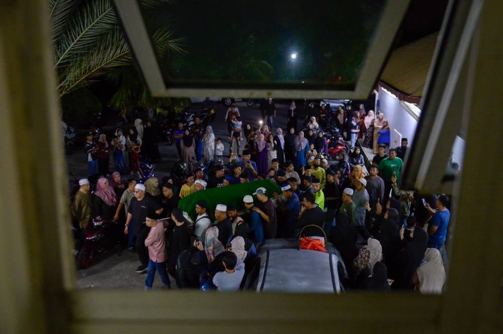 The body of Ahmad Shah Ahmad Ros, the Malaysian who was killed in a stabbing incident in South Korea, arrived at Bandar Tasik Puteri Mosque in Rawang, yesterday. - Photo by Bernama