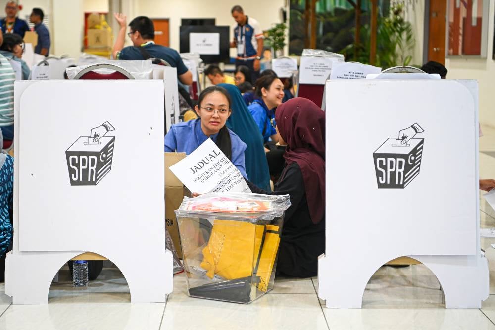 Election Commission (EC) personnel make final preparations for voting equipment kits ahead of tomorrow's polling day for the Negeri Sembilan State Election at the Official Vote-Tallying Centre, Wisma Majlis Bandaraya Seremban today. - Photo by Bernama
