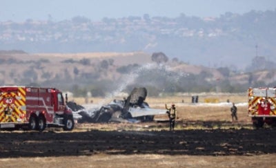 Fire crews spray down the wreckage of a US Marines’ F-35B fighter jet after it crashed into a field near Miramar Air Base in San Diego. Photo by AFP