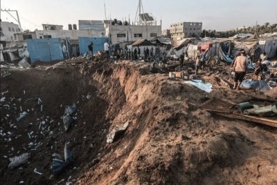 Israeli aircraft targeted the hospital’s medical supplies warehouse, destroying it and leaving a large crater at the strike site. 