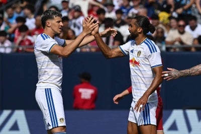 Dominic Calvert-Lewin #9 of Leeds United celebrates his first goal with Tarik Muharemovic #5 (Photo by Daniel Bartel / GETTY IMAGES NORTH AMERICA / Getty Images via AFP)