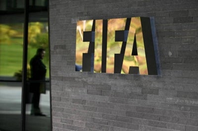 A sign of the FIFA is seen at the entrance of the world football's governing body headquarters on Oct 13, 2016 in Zurich. - (Photo by FABRICE COFFRINI / AFP)