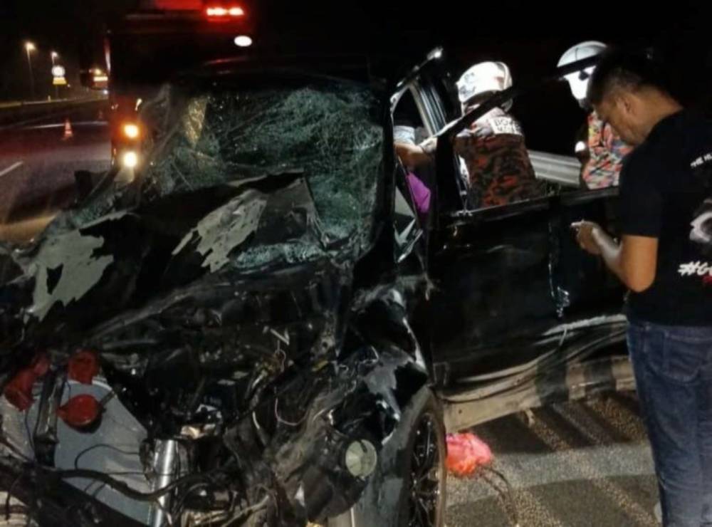 Initial investigations found that Abdul Wahid was driving a Toyota Estima MPV in the left lane when he came upon a herd of wild elephants on the road. Photo by Fire and Rescue Dept.