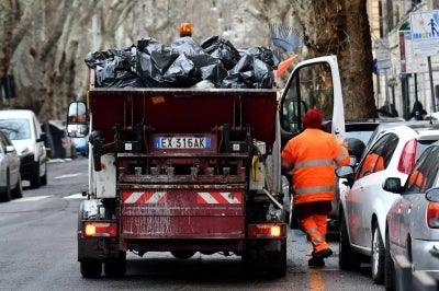 Toscano said his staff then spent hours sifting through the contents of a refuse lorry at a sorting facility after tracing the route of the rubbish collected from the lottery outlet.(Photo by Alberto PIZZOLI / AFP)