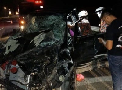 Initial investigations found that Abdul Wahid was driving a Toyota Estima MPV in the left lane when he came upon a herd of wild elephants on the road. Photo by Fire and Rescue Dept.