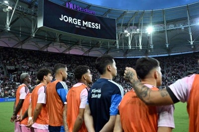 Inter Miami players observe a minute of silence in honor of Jorge Messi, the father and agent of Argentine football star Lionel Messi, ahead of the Leagues Cup 2026 group-stage football match between Inter Miami CF and Monterrey at Nu Stadium in Miami, Florida. Photo by AFP