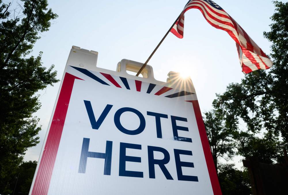 Signage directs voters at a polling place in the Tamarack Nature Center on August 11, 2026 in White Bear Township, Minnesota. Minnesota Lt. Gov. Peggy Flanagan and Rep. Angie Craig (D-MN) are vying for Minnesota's Democratic nomination for U.S. Senate in today's primary election. Stephen Maturen/Getty Images/AFP (Photo by AFP)
