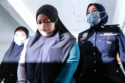 Housewife Nurul Farhana Laili Shah was charged in the Kota Tinggi magistrate's court today with the murder of a 16-month-old baby girl late last month. - Photo by Bernama