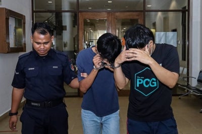 Mohd Shukrie Zainuddin, 28, and Muhammad Asyraf Zunaidy, 31, were each sentenced to 14 days’ jail and fined RM8,000 by the Kuantan magistrate’s court today after pleading guilty to forging 40 medical certificates between March and July. - Photo by Bernama