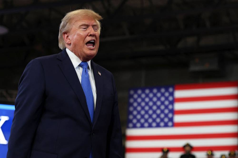 US President Donald Trump departs after delivering remarks at the David S. Mack Center for Training and Intelligence on Aug 14, 2026 in Garden City, New York. - (Photo by Samuel Corum / Getty Images via AFP)