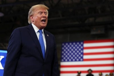 US President Donald Trump departs after delivering remarks at the David S. Mack Center for Training and Intelligence on Aug 14, 2026 in Garden City, New York. - (Photo by Samuel Corum / Getty Images via AFP)