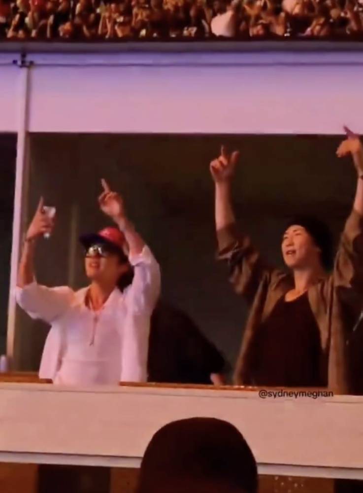 BTS members J-Hope (left) and RM (right) videoed enjoying themselves at Chris Brown's concert in Toronto, Canada. (Photo from Facebook)