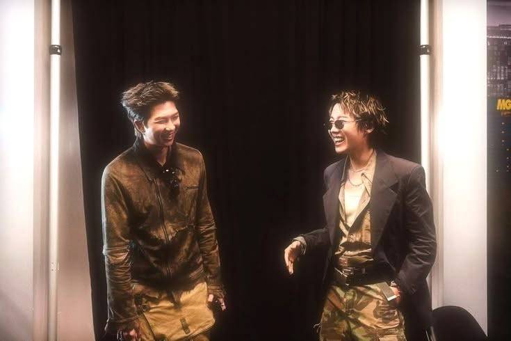 BTS members RM (right) and J-Hope (left) in a light hearted moment backstage. (Photo from Facebook)