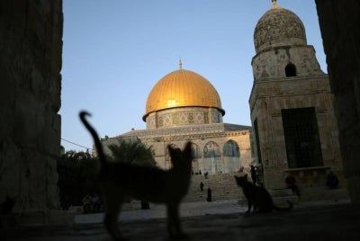Palestinian Muslim worshippers walk up the stairs in the grounds of the Dome of the Rock at the al-Aqsa Mosque compound on Aug 4, 2026. - (Photo by AHMAD GHARABLI / AFP)