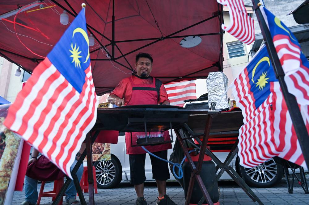 Batu Gajah night market stalls deck trading area in Jalur Gemilang for National Month