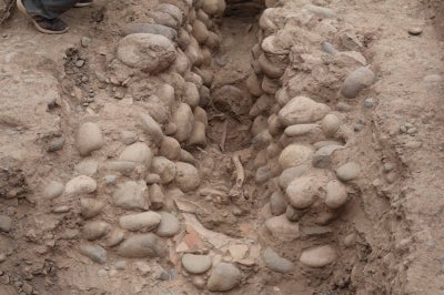 The skeleton was found lying along the channel, oriented in a north-south direction and resting on its left side. Its skull was facing west toward the pyramid and the Pacific Ocean. (Photo taken from Facebook)