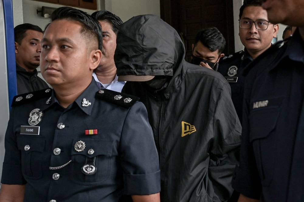 Immigration Department ‘Black Maria’ lorry driver Mohd Akbar Zainol, 43, was charged today with five offences, including dangerous driving that resulted in the deaths of a father and his two daughters yesterday. - Photo by Bernama
