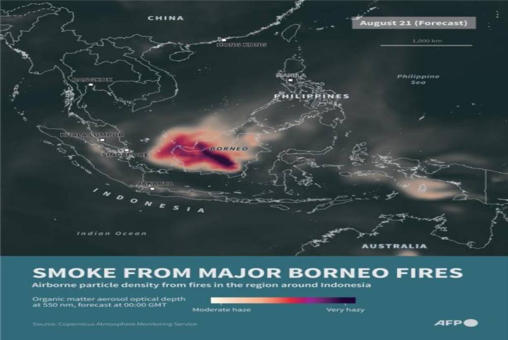Infographic map showing density of smoke around Indonesia using Copernicus Atmosphere Monitoring Service (CAMS) data. - (Graphic by NICHOLAS SHEARMAN / AFP)