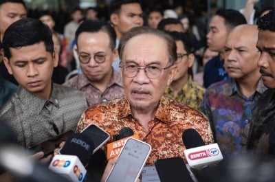Prime Minister Datuk Seri Anwar Ibrahim speaks to reporters after officiating the TikTok Shop Summit Malaysia today. - Photo by Bernama