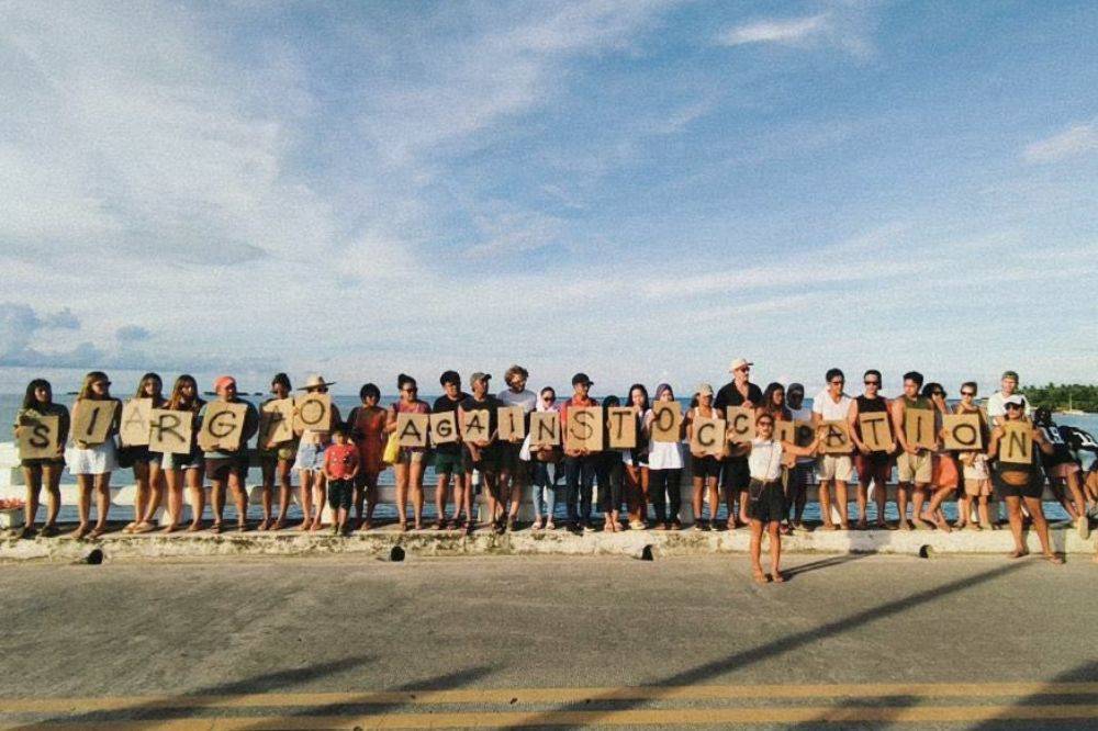 Siargao residents pose during a sign a petition gathering for “No to Chabad House in Siargao”. (Photo from Philippines-Palestine Friendship Association FB)