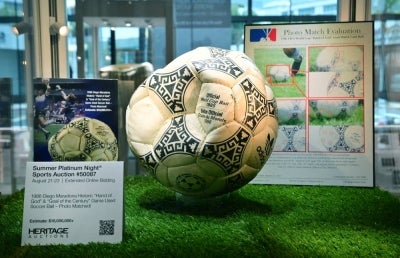 The ball that was used in the 1986 World Cup match between Argentina and England during which Argentina's Diego Maradona scored the "Hand of God" goal is displayed before auction at Heritage Auctions in Beverly Hills, California, on Aug 7, 2026. - (Photo by FREDERIC J. BROWN / AFP)