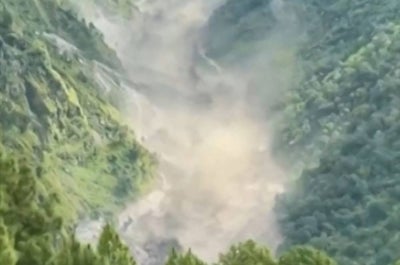 This frame grab from a UGC footage courtesy of Nepal Police shows floodwaters crashing through the Bhote Koshi River after flash floods in Rasuwa district. Photo by -UGC/Nepal Police/AFP