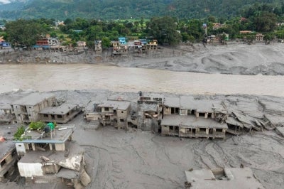 An aerial view shows houses lying deluged in sludge after flash floods at Devighat, Bidur Municipality in Nepal's Nuwakot district on Aug 27, 2026. - (Photo by PRABIN RANABHAT / AFP)