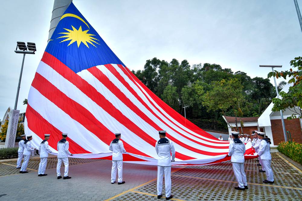 Royal Malaysian Navy flag bearers prepare for the ceremony to raise the Jalur Gemilang at Southeast Asia’s tallest flagpole in conjunction with the 69th National Day celebrations at Dataran Selangor, Shah Alam Club, Seksyen 13 on Aug 26, 2026. - Photo by Bernama