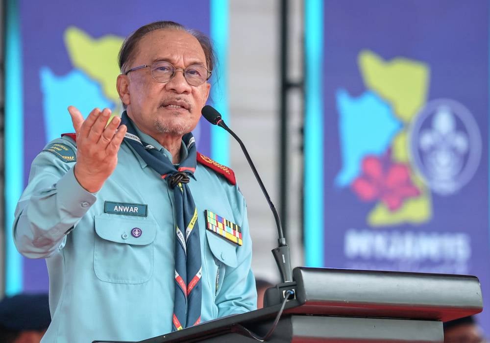 Prime Minister Datuk Seri Anwar Ibrahim delivering his speech at the 15th Malaysian Scouts Jamboree (MYJAM15) at the Penang State Stadium today. - Photo by Bernama