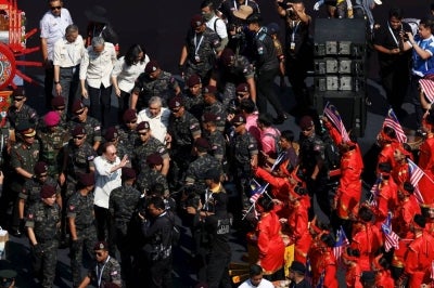 Prime Minister Datuk Seri Anwar Ibrahim mingles with the participants of the performance at the 2026 National Day Celebration at Dataran Putrajaya today. (BERNAMA PHOTO) 