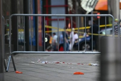 Blood is seen at the scene where an officer-involved shooting left one dead near Times Square, in New York, on Aug 31, 2026. A woman armed with a knife stabbed two people in New York's Times Square on Monday before she was shot by police, US media reported. - (Photo by ANGELA WEISS / AFP)