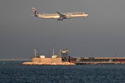A Qatar Airways passenger aircraft lands at Hamad International Airport in Doha on Aug 30, 2026. - (Photo by Mahmud HAMS / AFP)